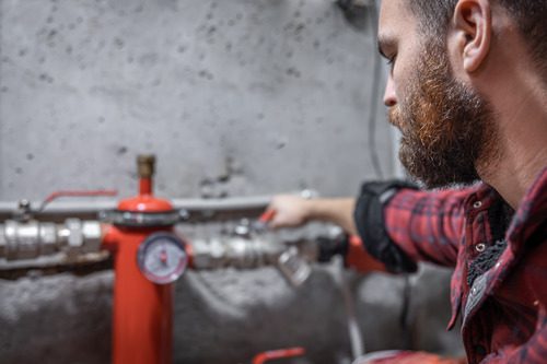 Plumber looks &checking emergency repair